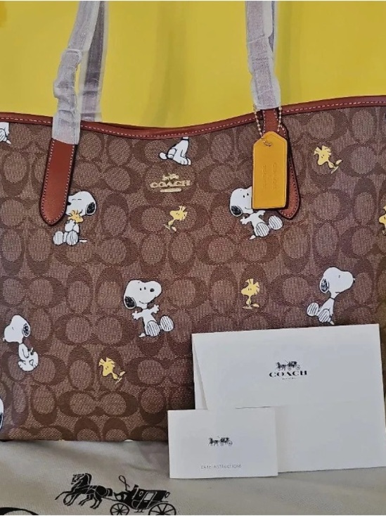 Coach Handbags - COACH Brown Snoopy & Woodstock Signature Canvas Tote with Yellow Tag